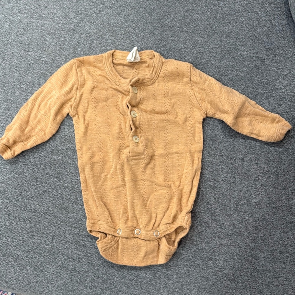 Kate Quinn Carmel Onesie